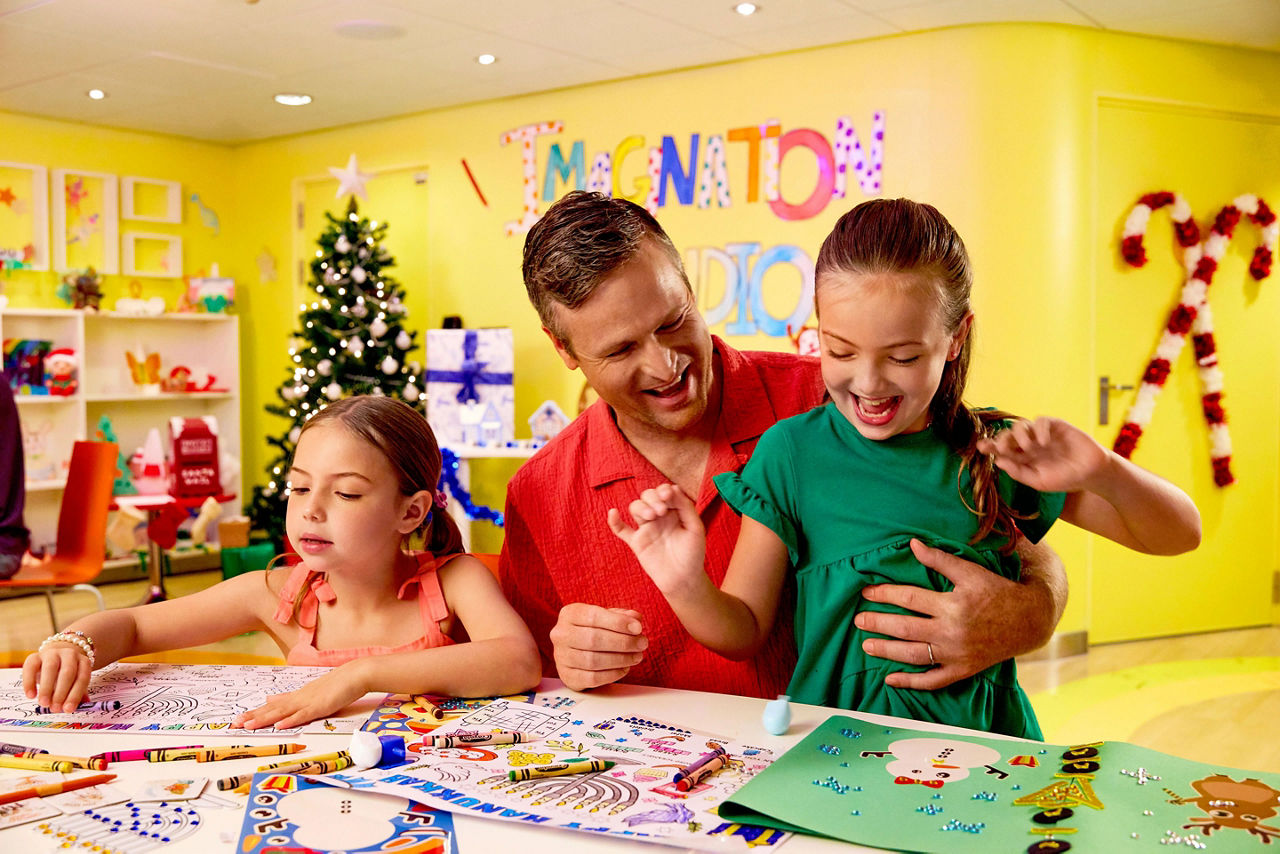 Family making Hannukah crafts in Adventure Ocean