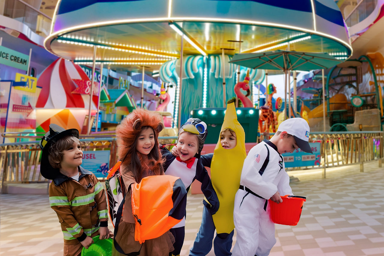 Kids celebrating Monster Bash Halloween-themed special event.