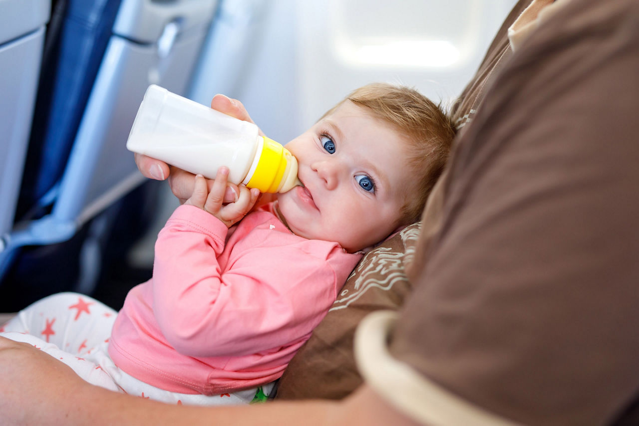 Baby in Airplane Feeding