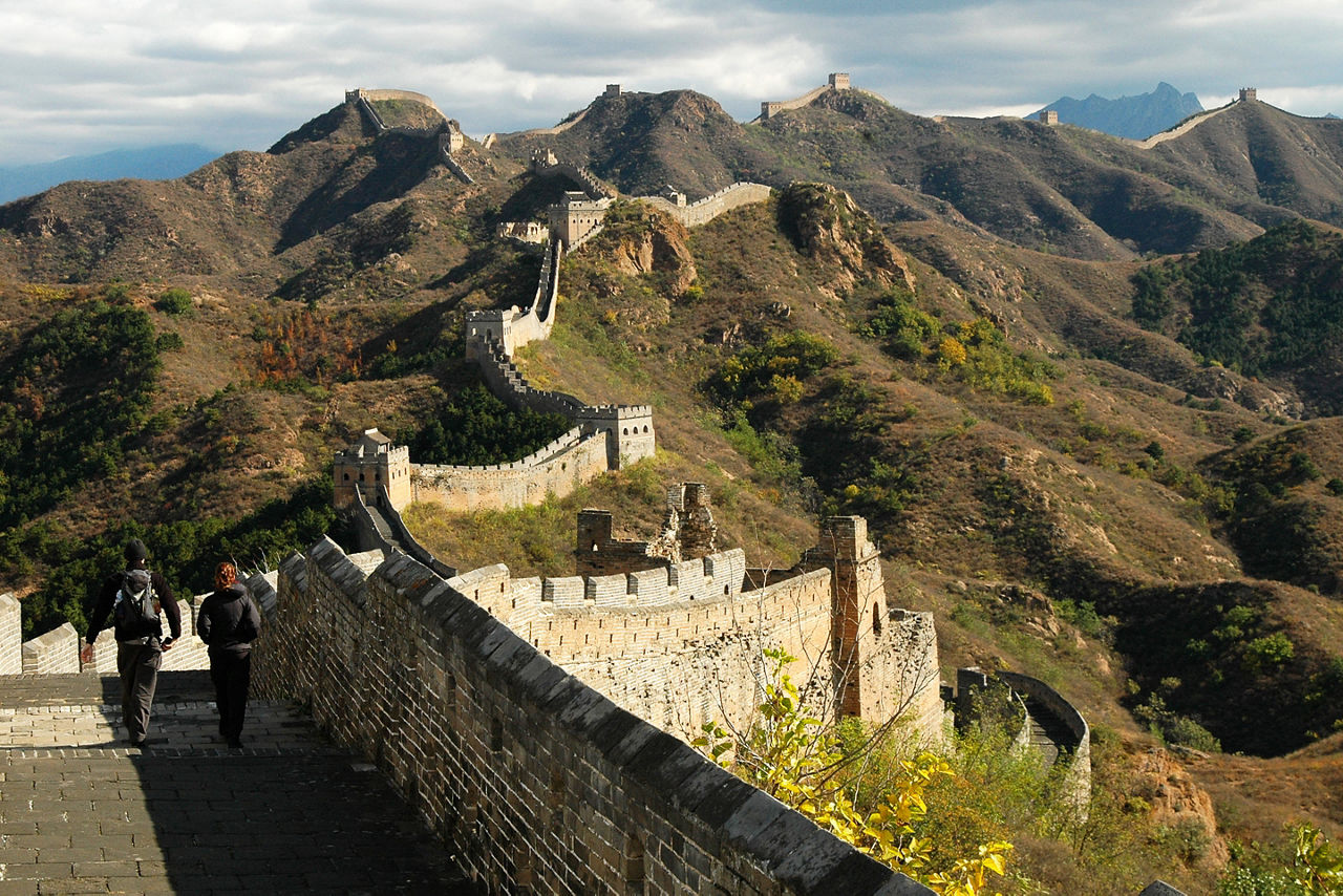 vacation couple walking along the Great Wall of China. Asia