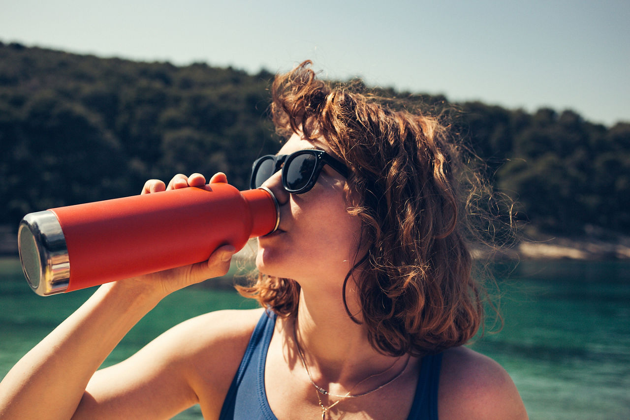 Woman Hydrating During her Shore Excursion