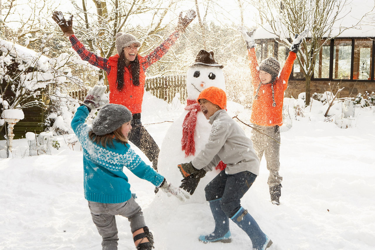 Family Bonding over Games in the Snow, New York, NY 