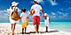 Family of four on a tropical summer beach getaway vacation. The Caribbean.