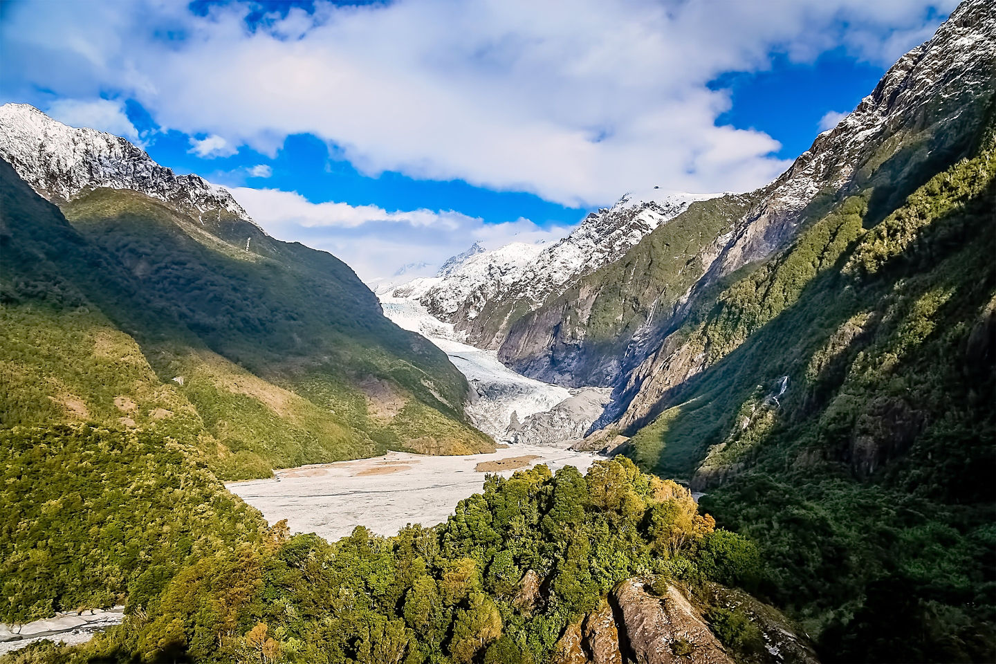 Franz Josef Glacier descends between rugged mountains. - Westland Tai Poutini National Park, New Zealand