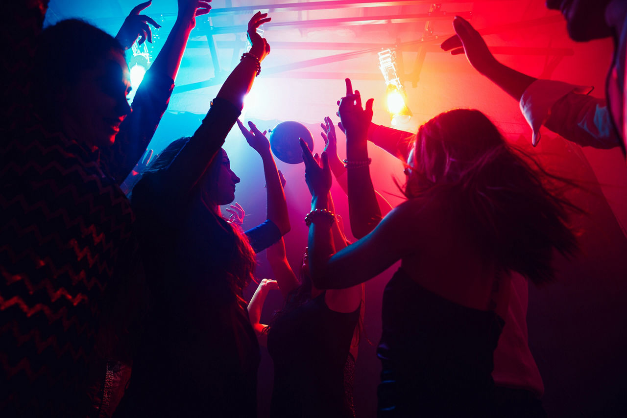 Group partying, dancing on the dance floor.