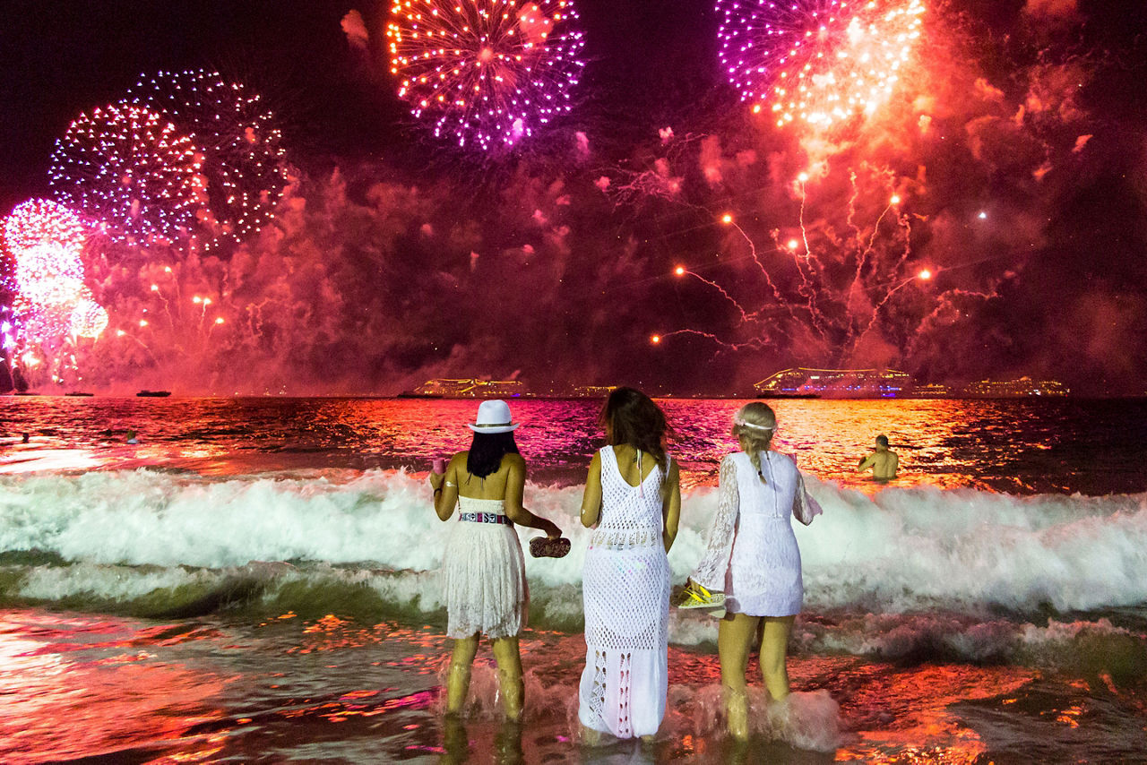 Friends Watching the New Year’s Tradition of Fireworks in Rio de Janeiro, Brazil