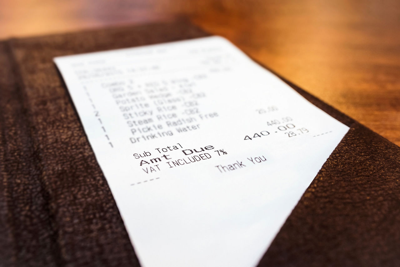 Receipt, bill, tab, payment in brown leather case