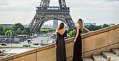 Two girl friends looking to the Tour Eiffel in Paris.