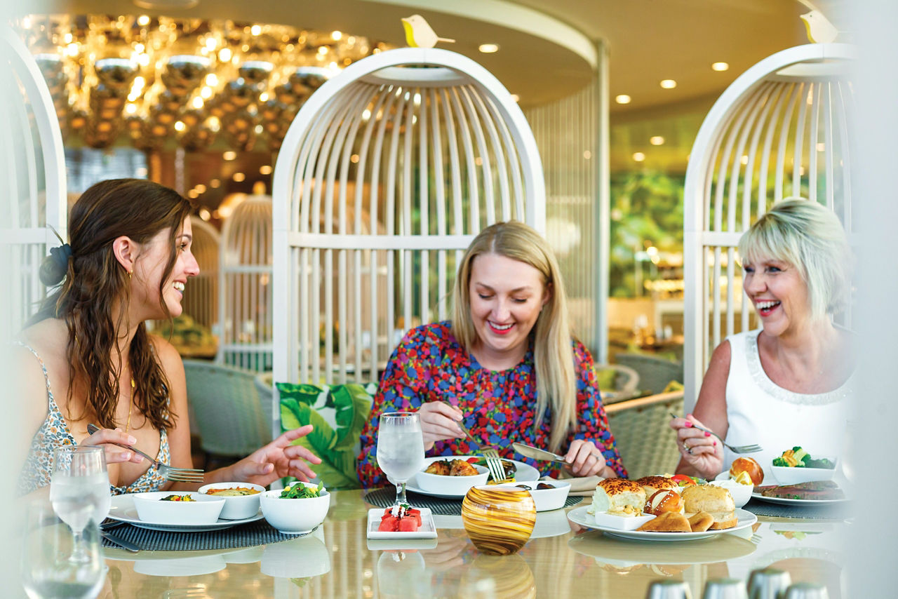 A mother with her daughters dinning at Solarium Café and Bar