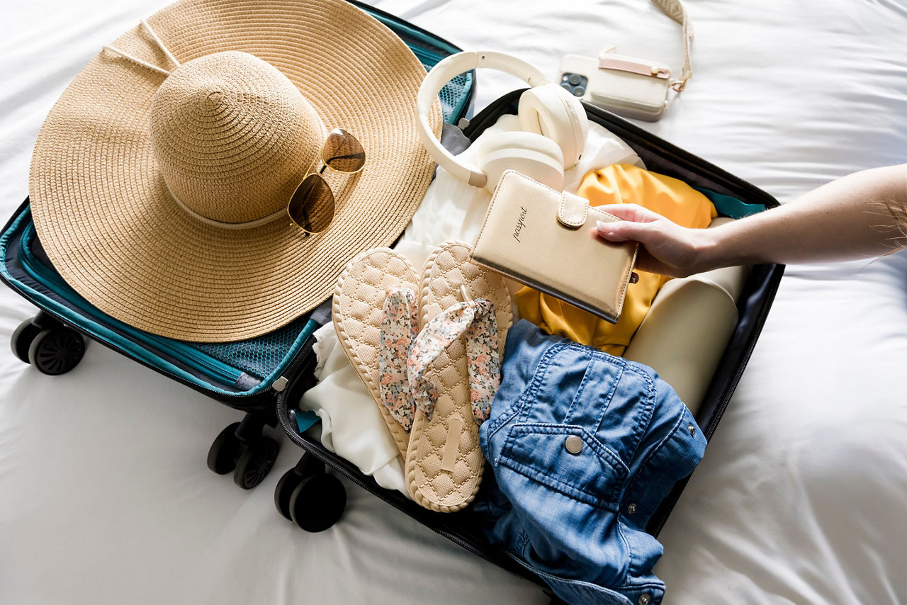 Woman packing for a summer vacation