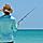 An unidentified local young man on the beach fishing in the shallow water of the Gulf of Mexico.  
