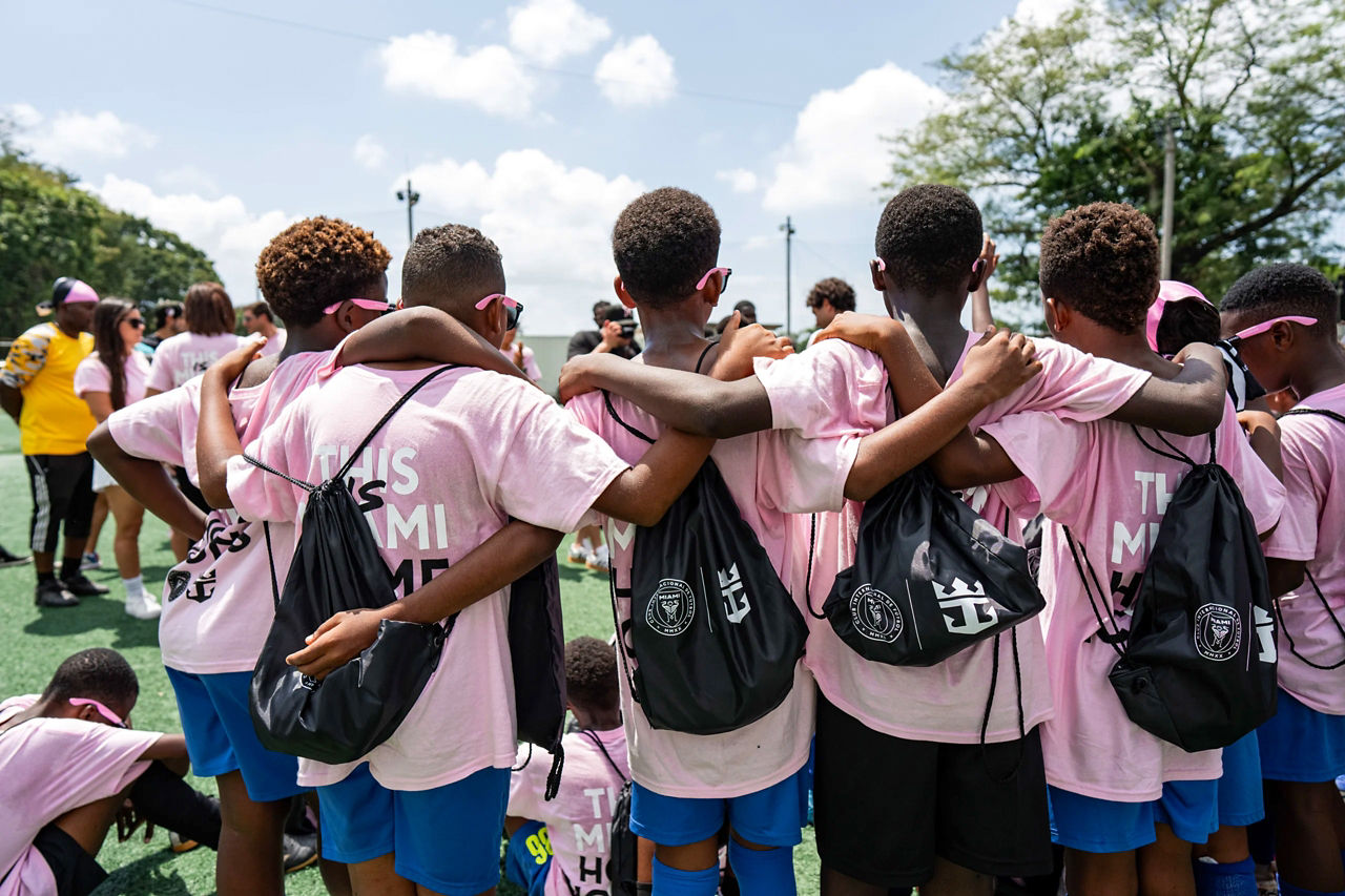 Children wearing pink Miami shirt.