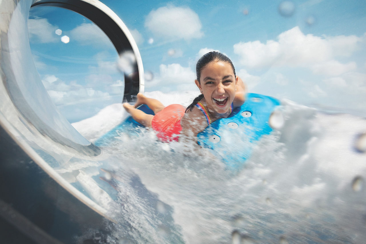 girl enjoying riptide ride in water slide