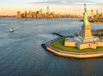 Statue of Liberty surrounded by body of water
