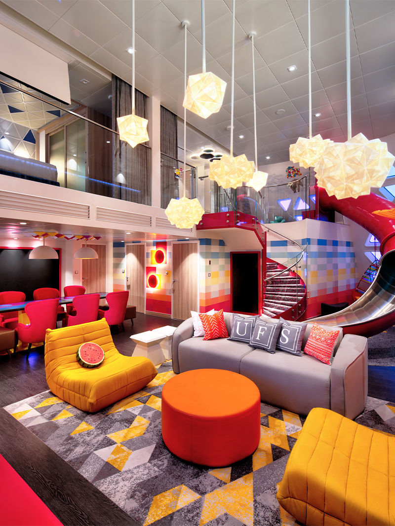 Oasis Class, Wonder of the Seas Ultimate Family Suite Living Room with Slide Crop