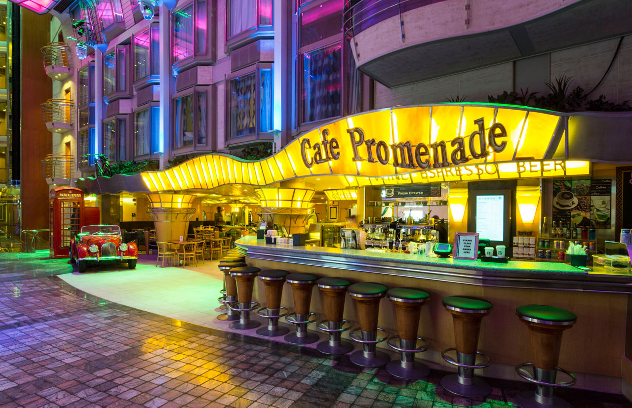 Cafe Promenade Bar with Red Vintage Car in Background