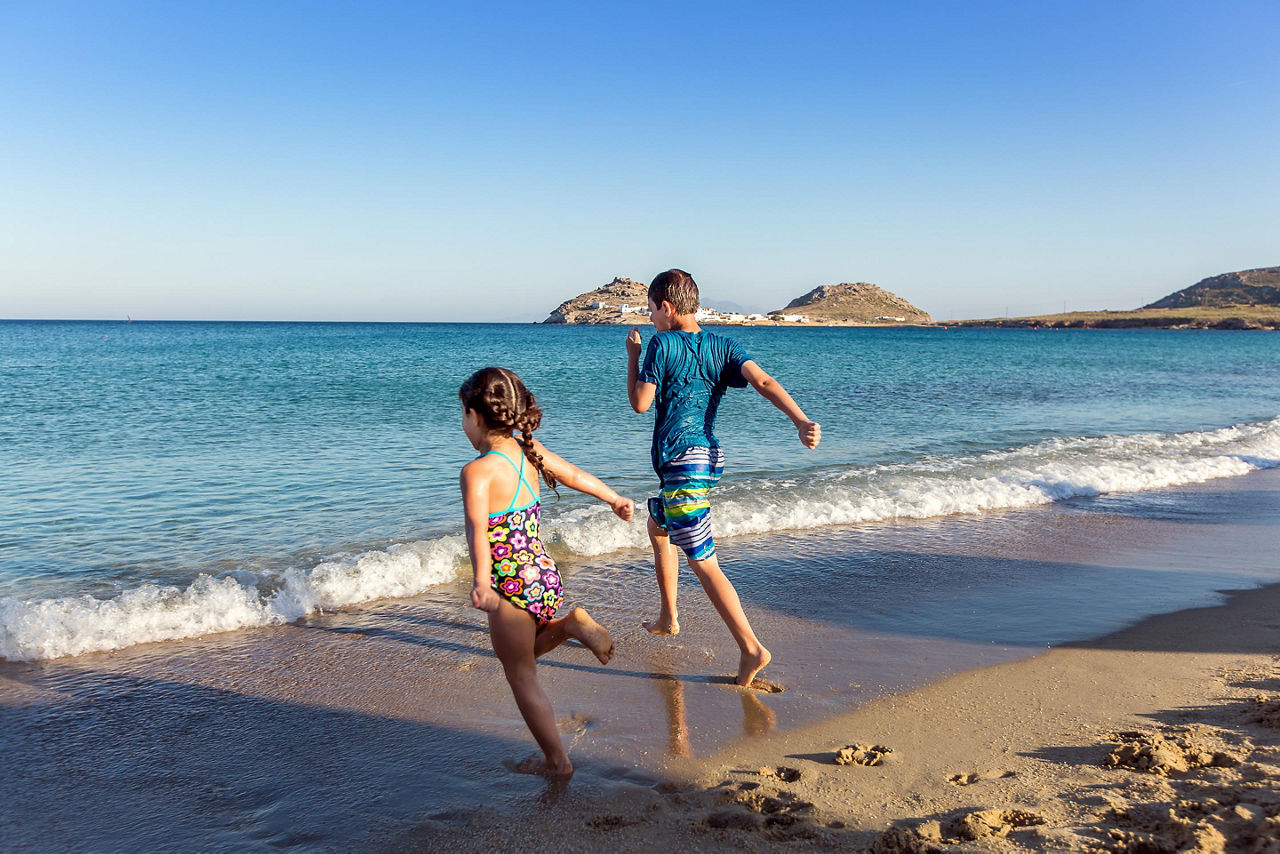 Kids Playing Running at the Beach