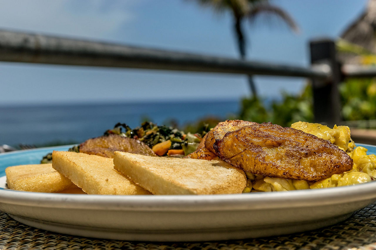 Typical Breakfast Fried Bammy Plantains Ackee and Saltfish from Jamaica 