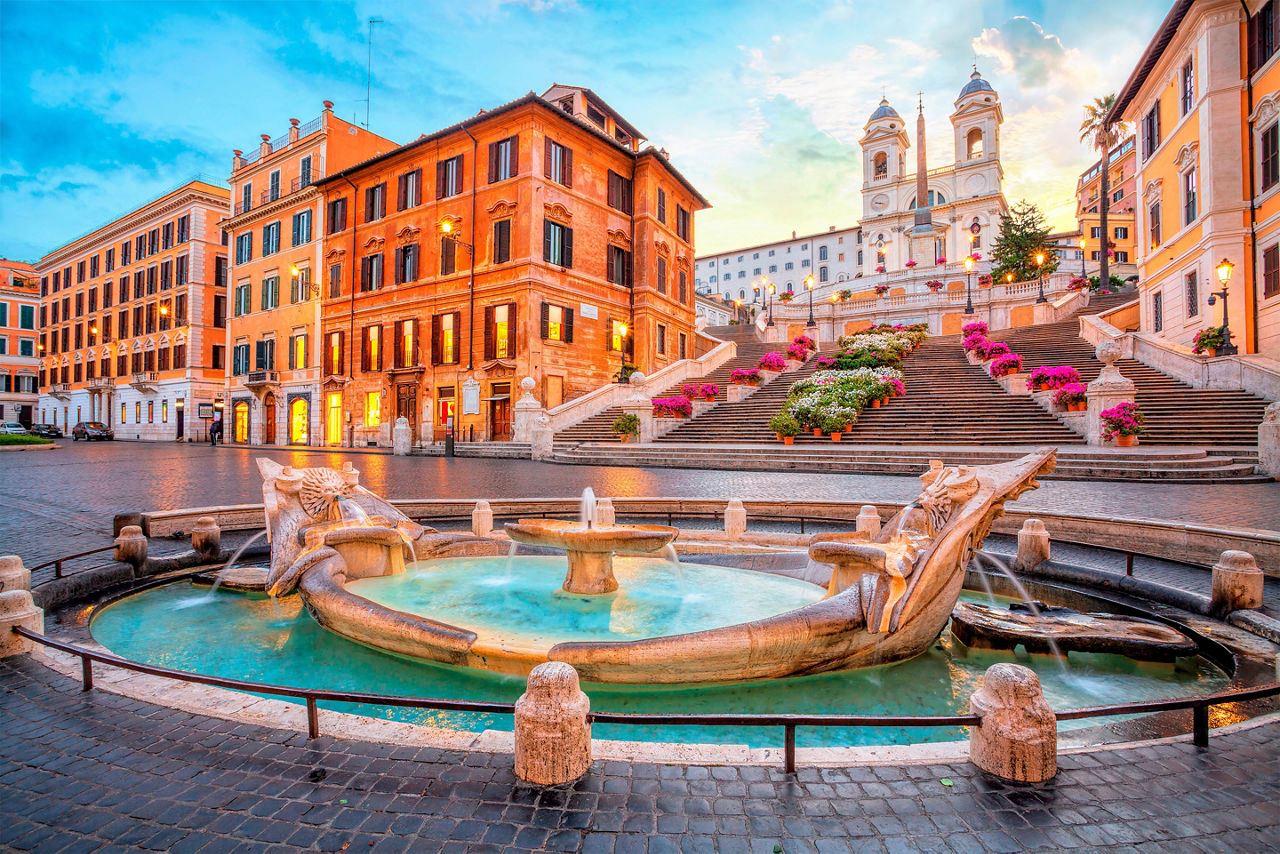 the golden fountain of the Piazza de Spagna at sunrise. Europe.