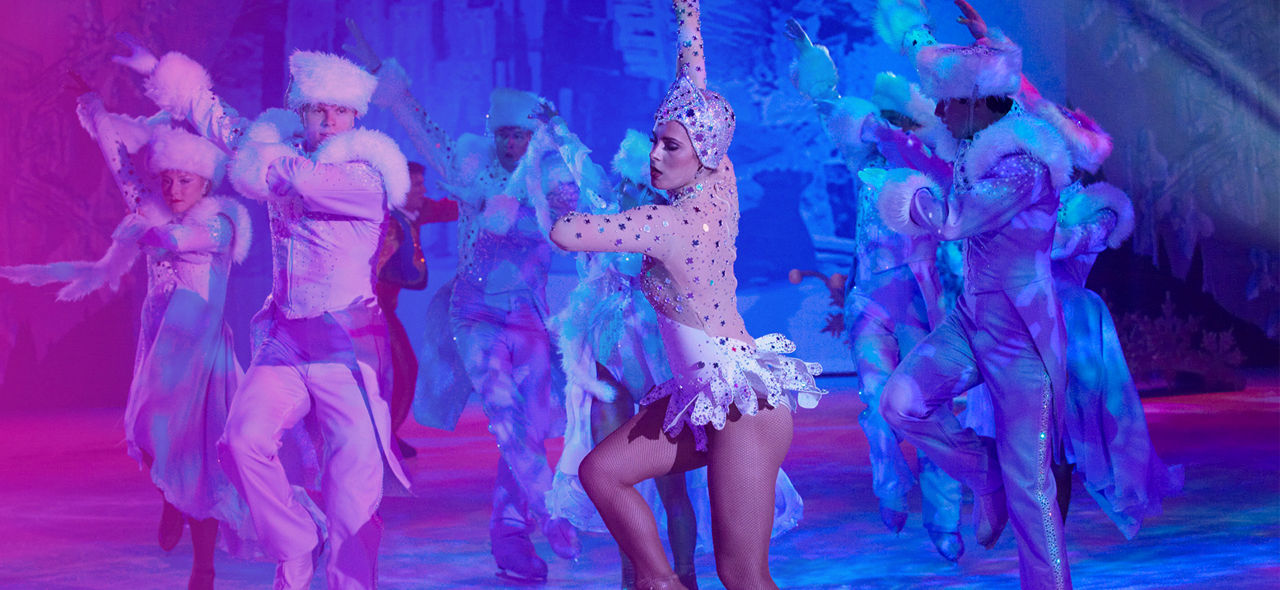 Woman ice skating during an ice skating cruise show.