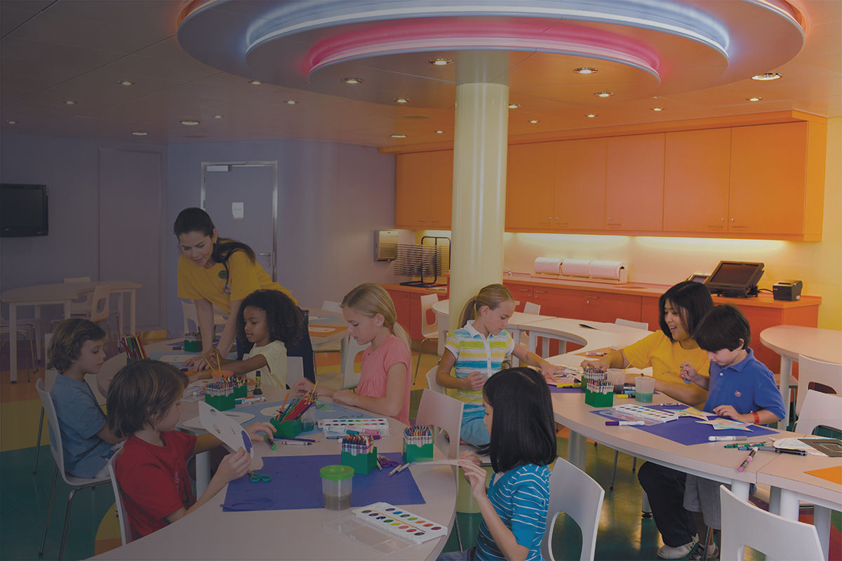 Children creating art at the Adventure Ocean Art activity onboard a Royal Caribbean cruise.