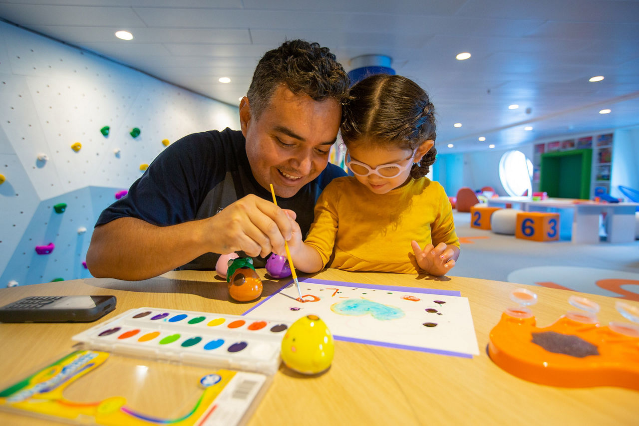 Father and Daughter Using Water Colors in Adventure Ocean