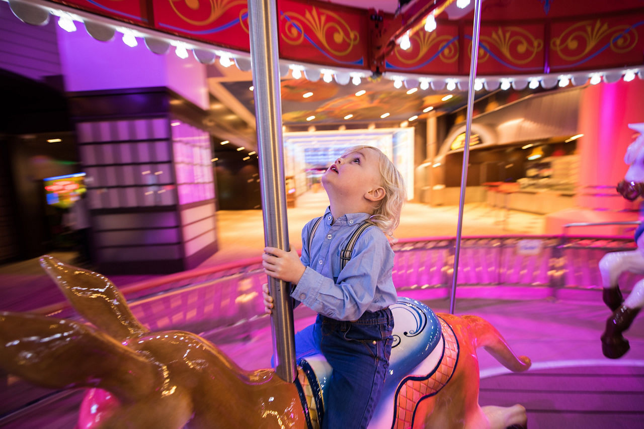 Young Boy Enjoying the Carousel 