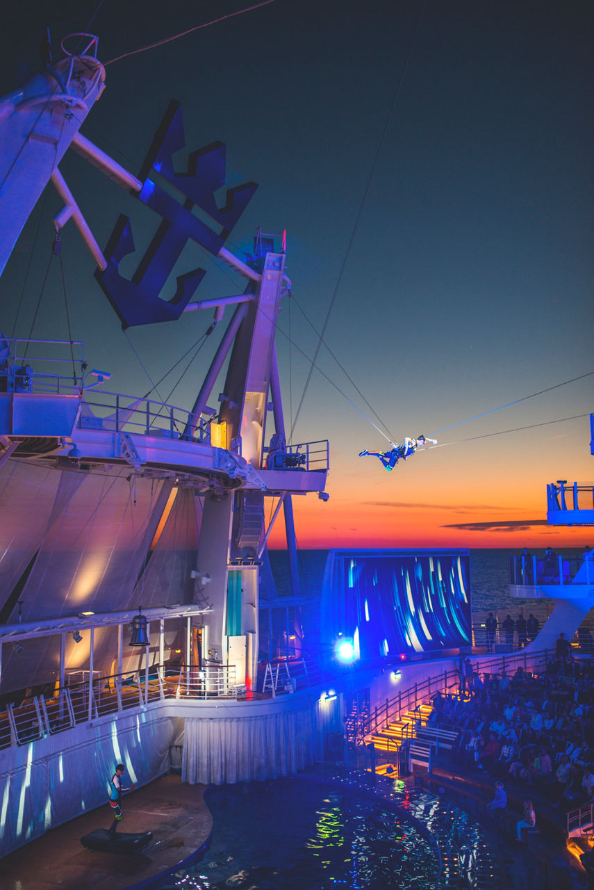The Fine Line Cruise Show Performer doing tight rope activity 