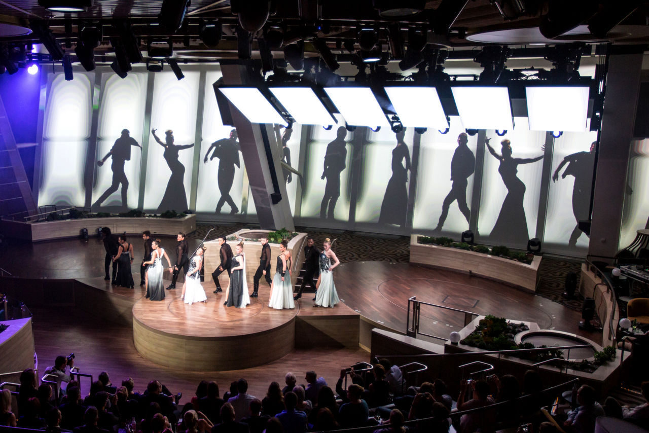 Performers on stage with their sillouettes behind them during the Starwater show on Quantum.