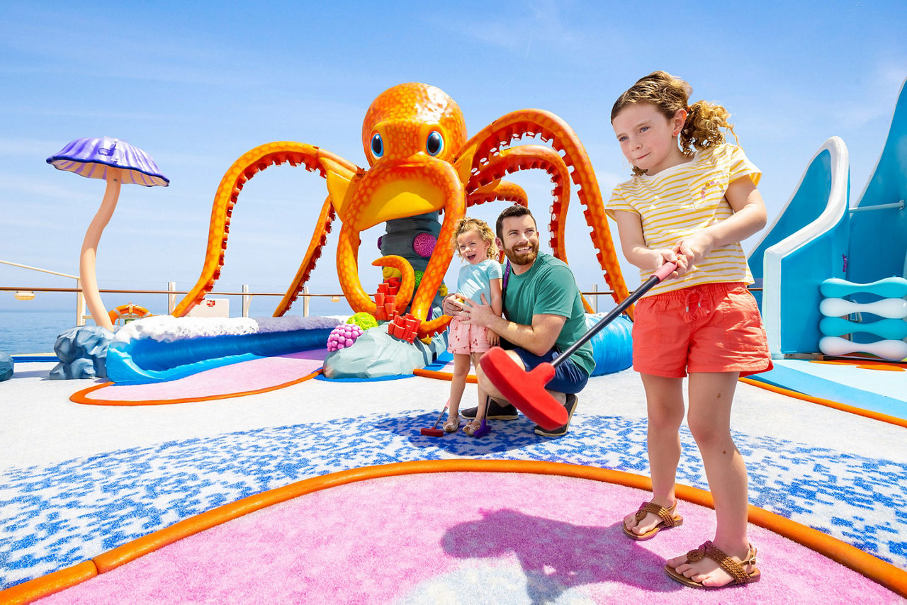 Family Enjoying Mini Golf at Wonder Dunes