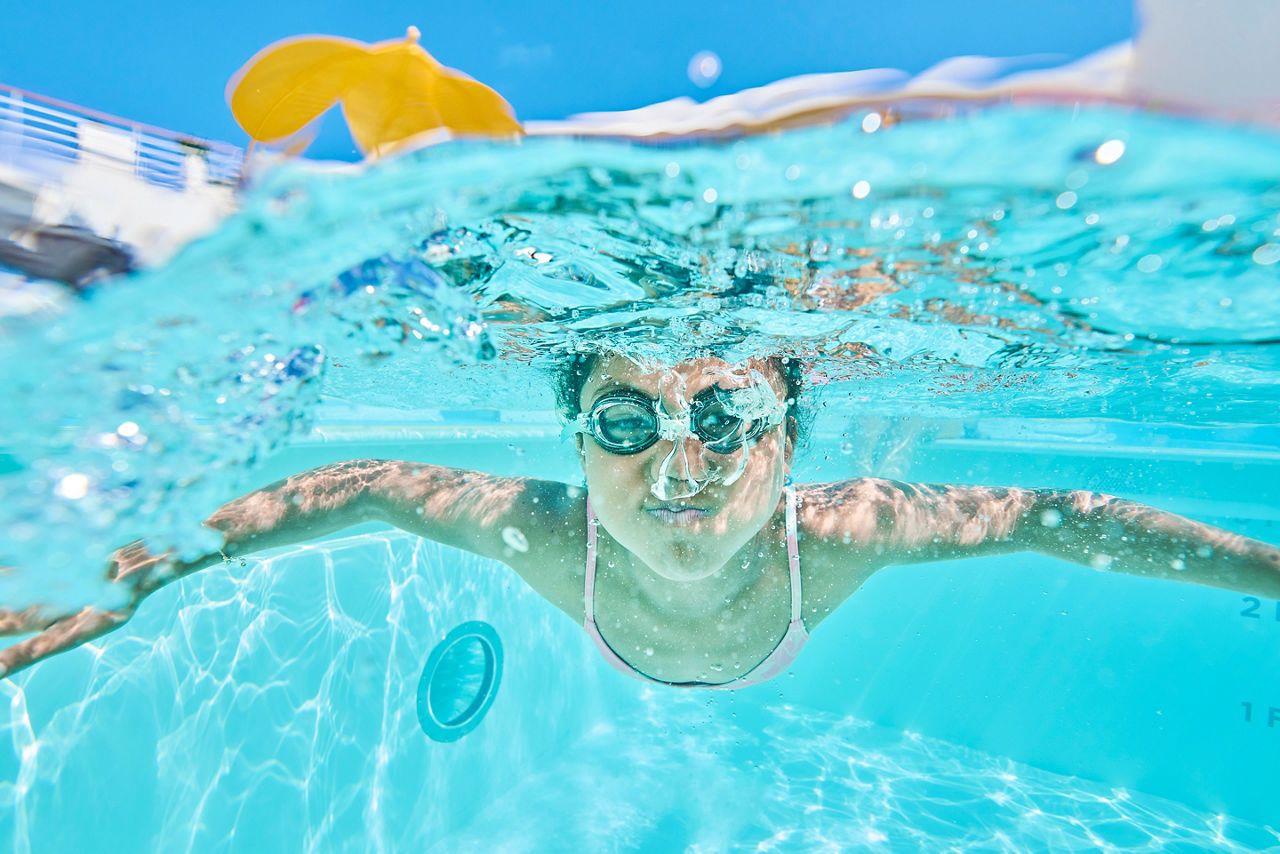 Pool Boy Swimming Underwater