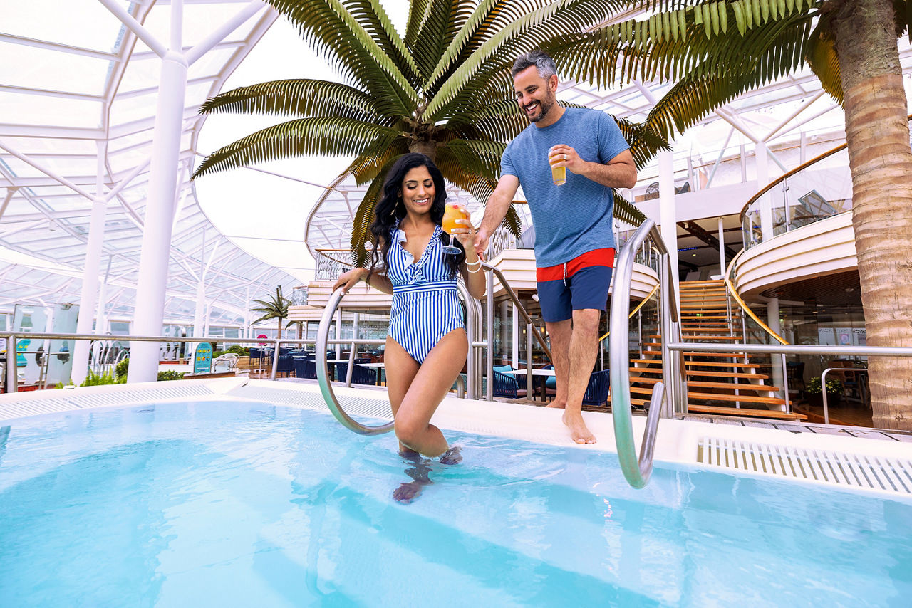 Couple Entering the Pool at the Solarium