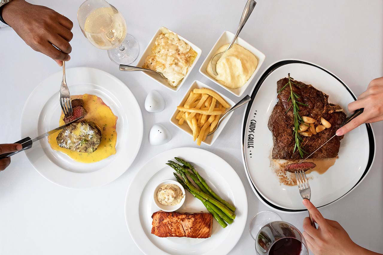 Couple Enjoying a Nice Steak Dinner 