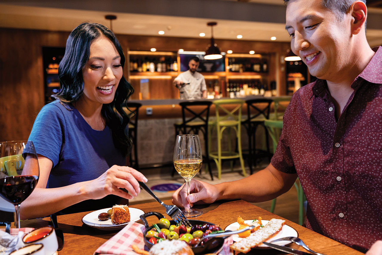 Giovanni's Italian Kitchen Couple Enjoying Olives and Wine