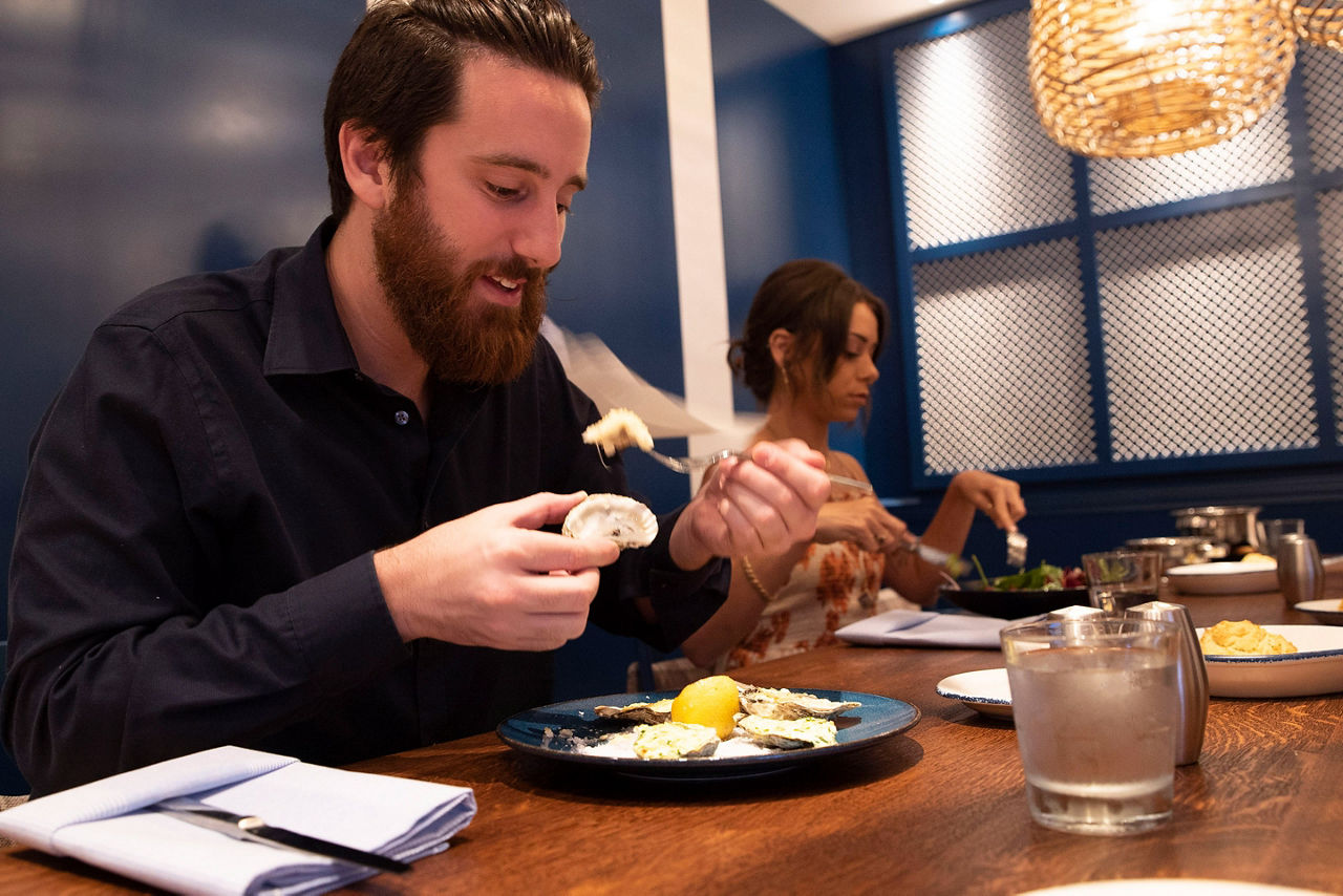 A Couple Enjoying Oysters at Hooked