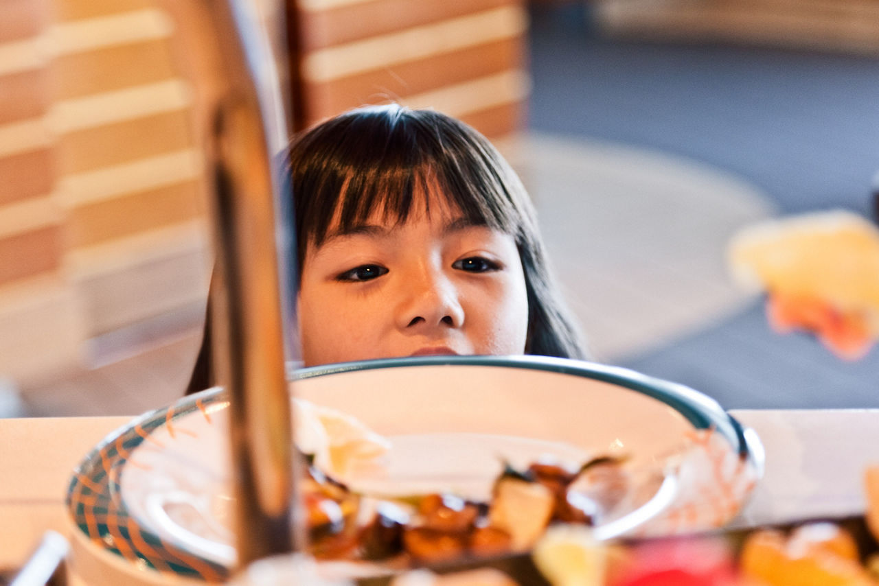 Girl Enjoying Breakfast at the Windjammer