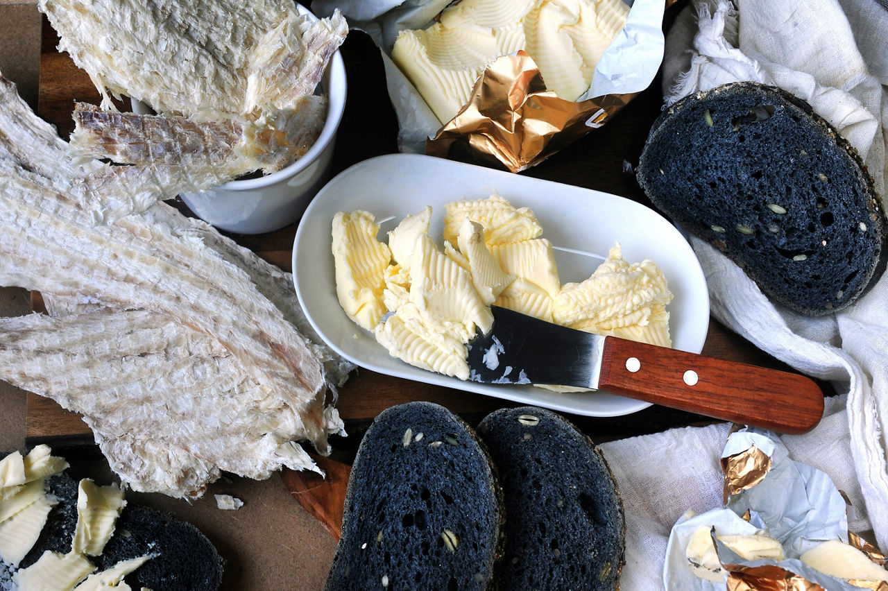 Hardfiskur dried fish with a side of charcoal bread and butter