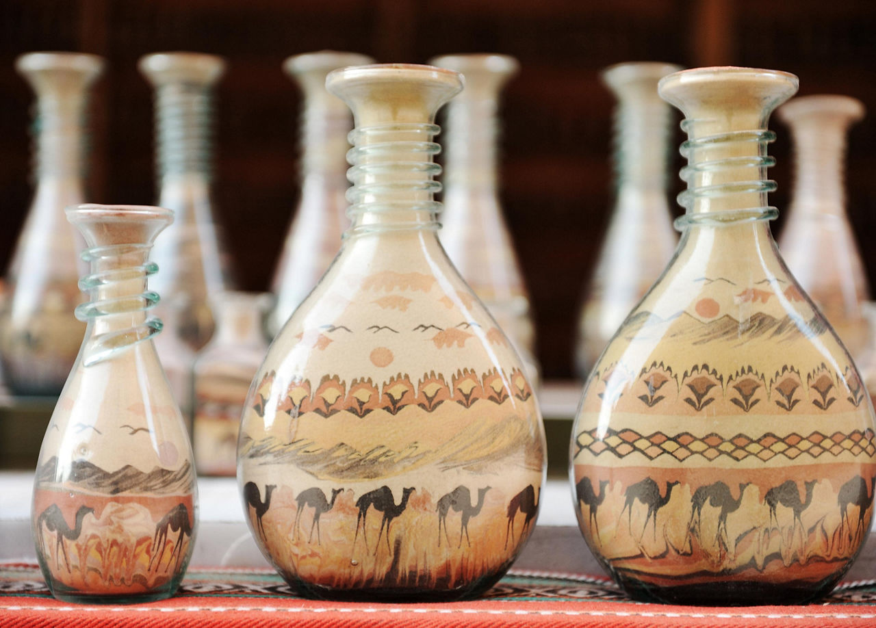 Bottles made of shape with shapes of deserts and camels while shopping in Aqaba, Jordan