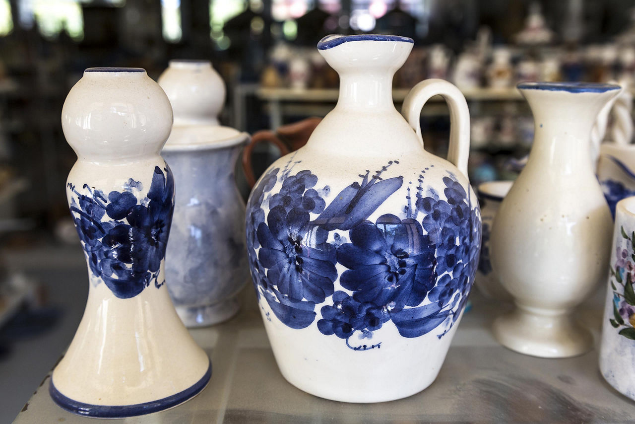 Traditional Greek ceramic pottery with blue floral decorations, on a shop in Corfu, Greece