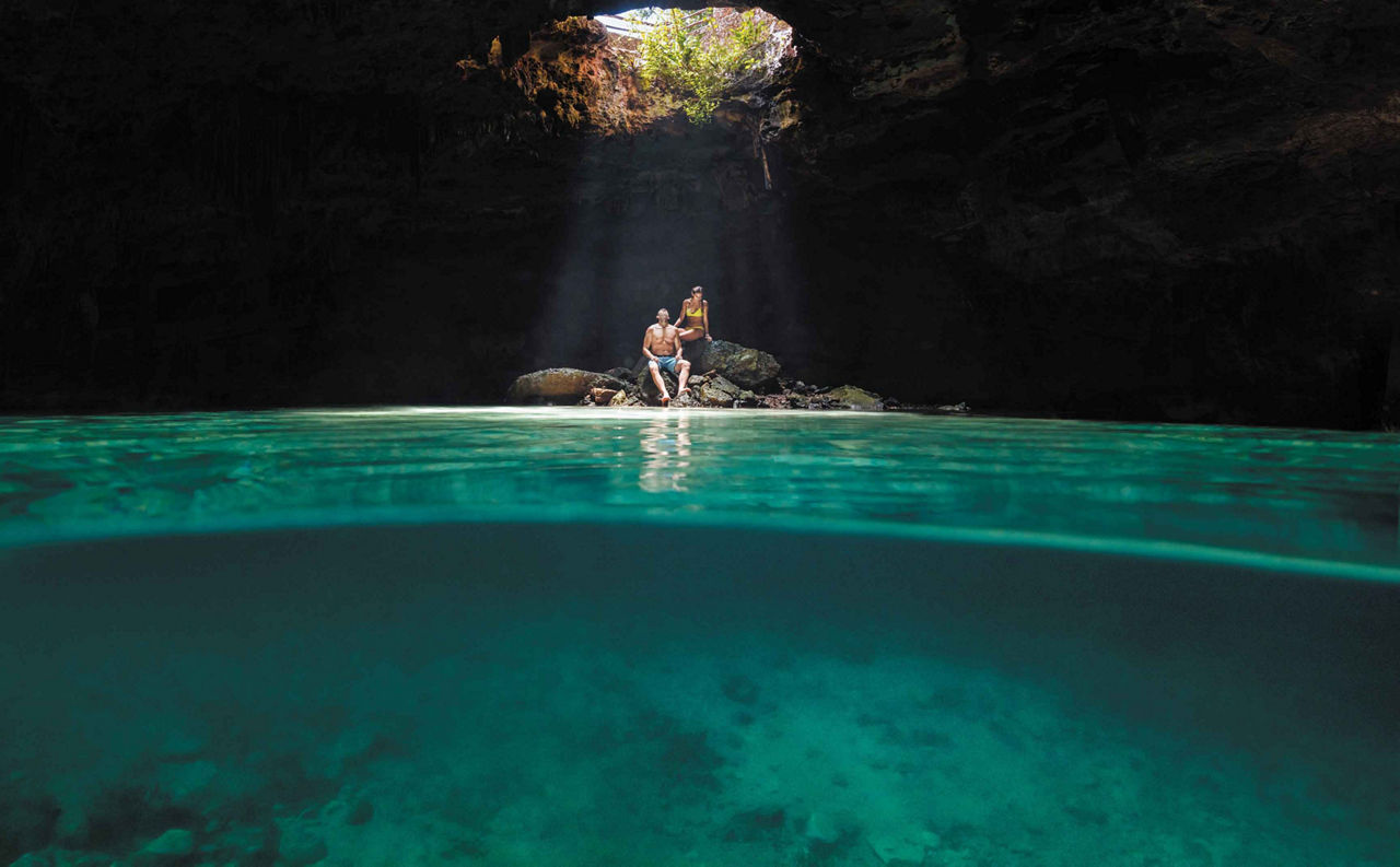 Couple on their Cruise Vacation Inside of a Cenote, Cozumel, Mexico 