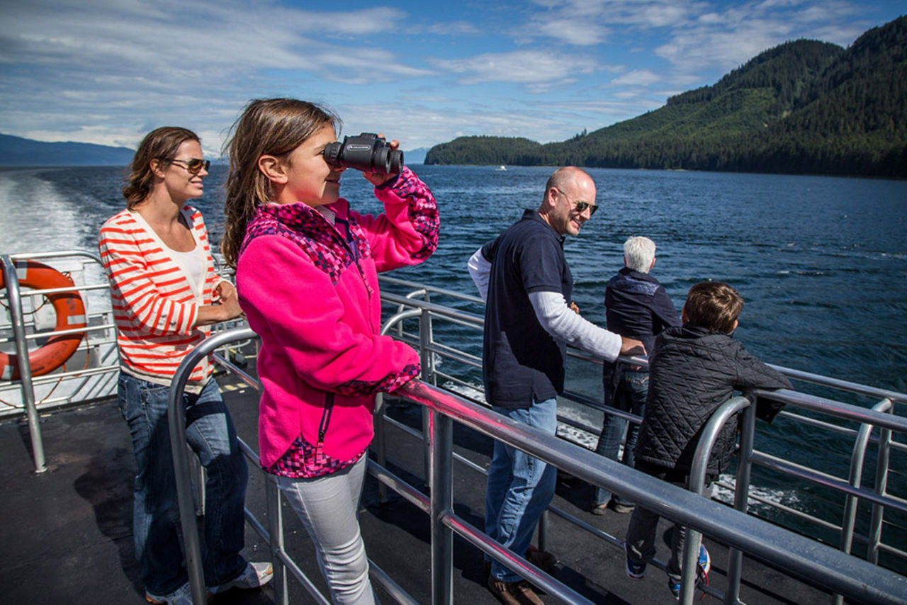 Girl Staring at Fjords on a Boat Excursion, Inside Passage, Alaska