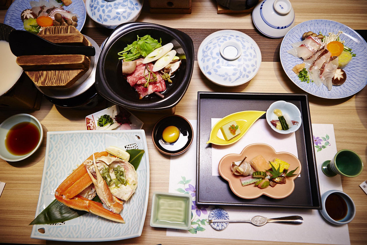 Kaiseki and traditional Japenese cuisine layed out on a table