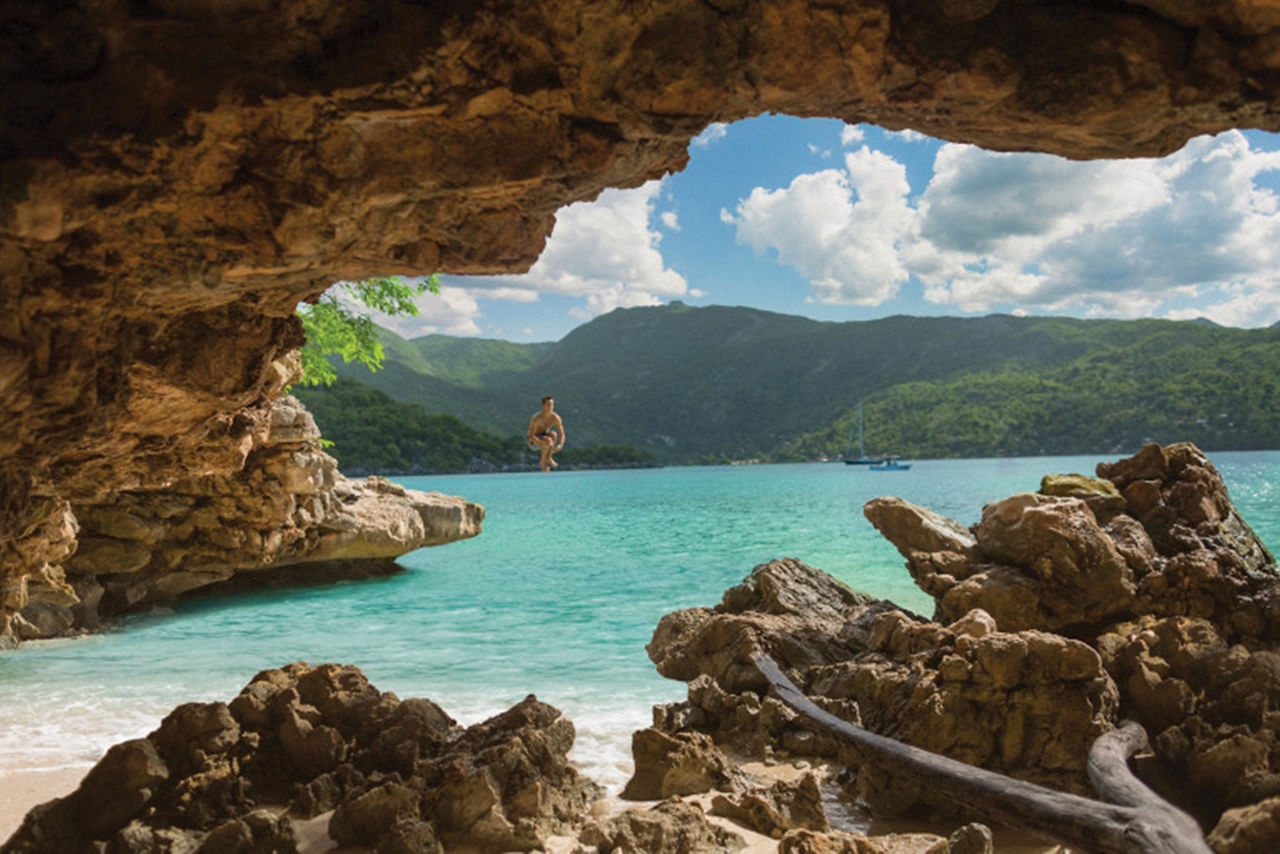 Labadee Haiti Man Cliff Diving off a Cave Rock