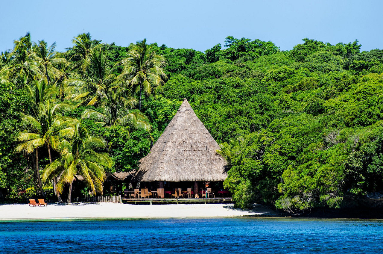 A traditional hut on a beach on Lifou, Loyalty Islands