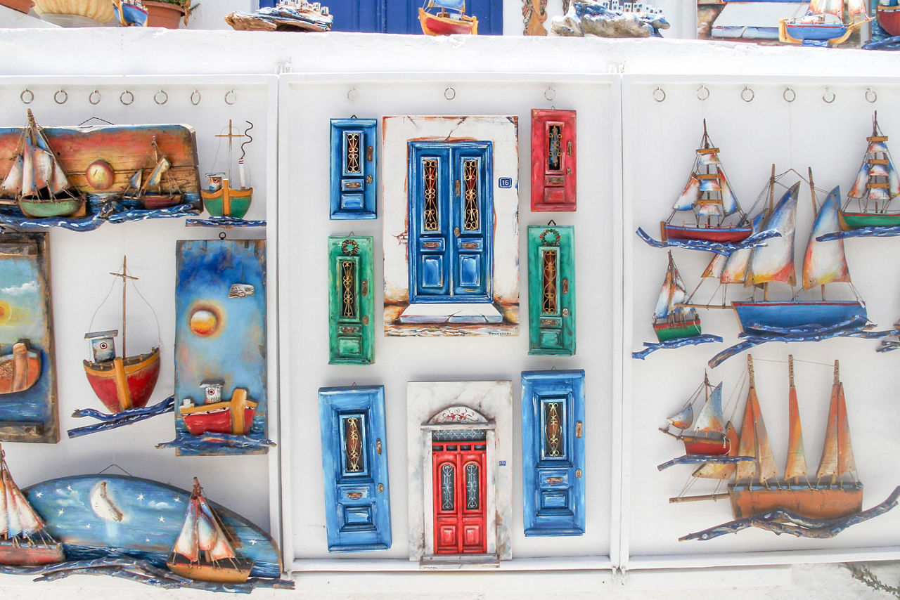 Souvenirs hanging on a wall outside a shop, Mykonos, Greece