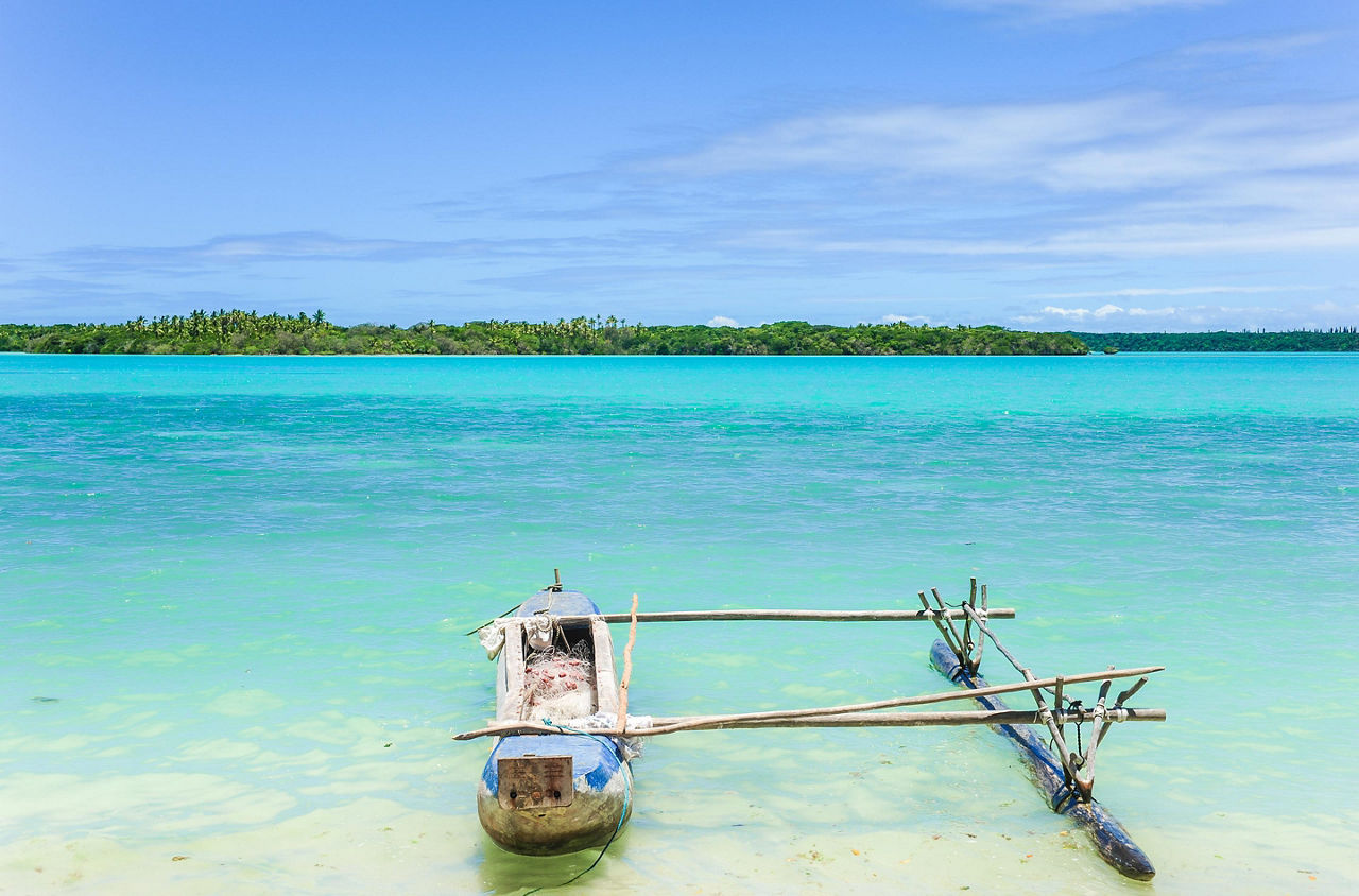 A beach paradise with a wooden boat in Mystery Island