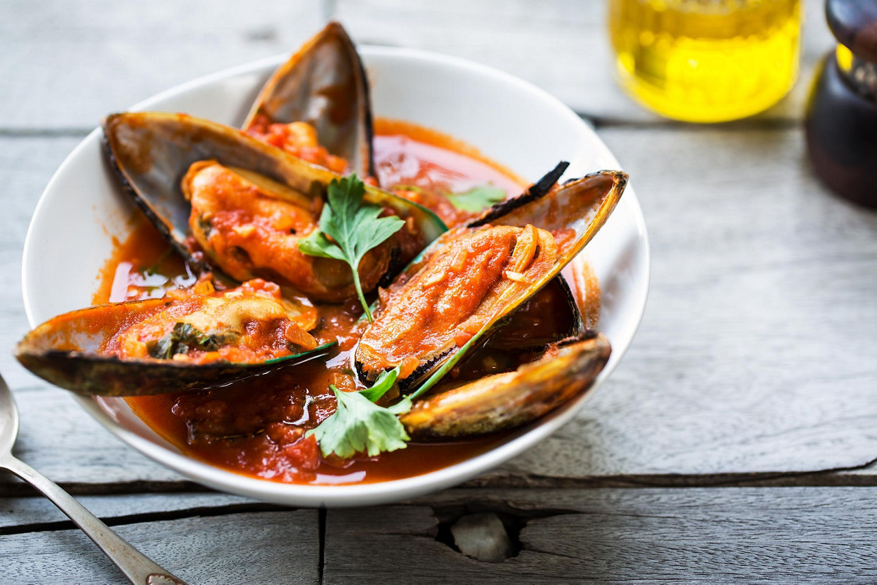 Mussels in tomato and herb sauce in New Zealand