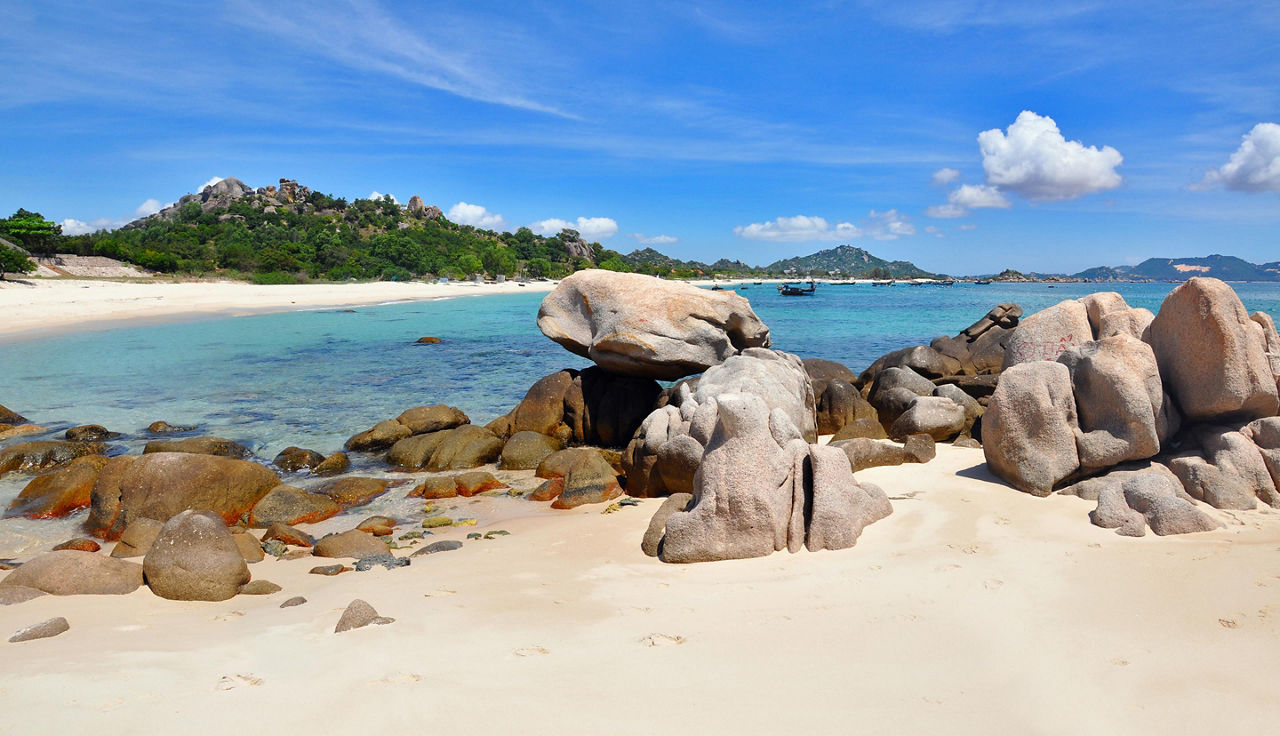 The Bai Dai beach will large rocks on the shore in Cam Ranh, Vietnam