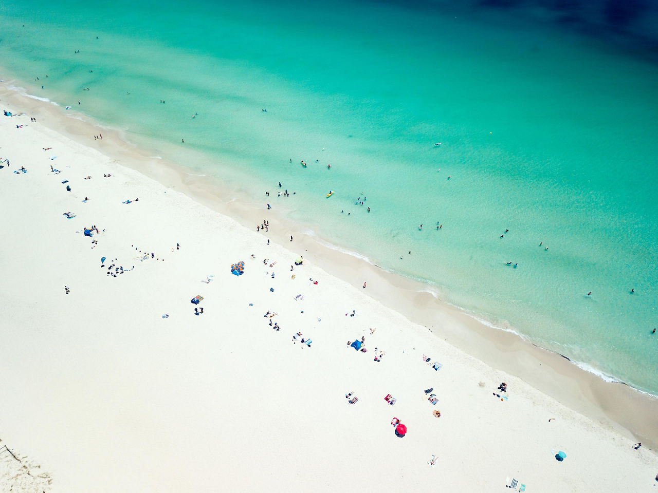 An aerial viw of Leighton Beach with lots of beach goers enjoying the day in Perth