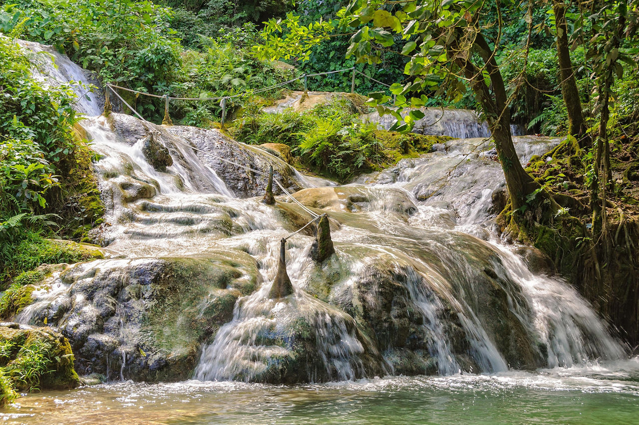 Slippery path with guide ropes at Meele Cascades Waterfalls in Port Vila, Vanuatu